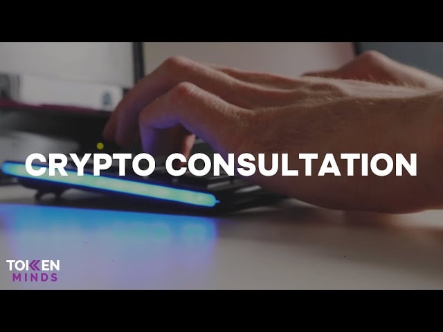 Crypto Consultation: hands typing on a keyboard lit in blue, with the TokenMinds logo