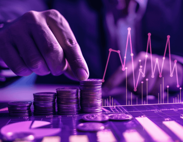 A hand stacking coins beside a rising price chart
