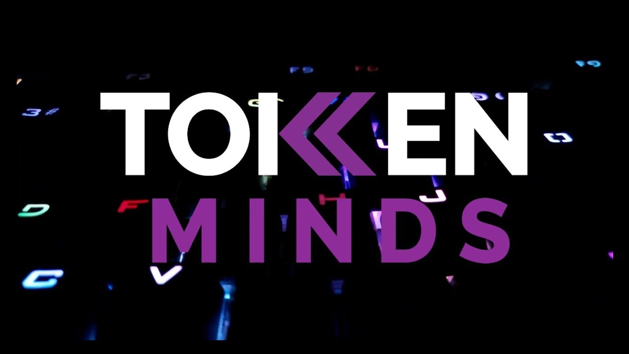 The TokenMinds wordmark over a backlit keyboard