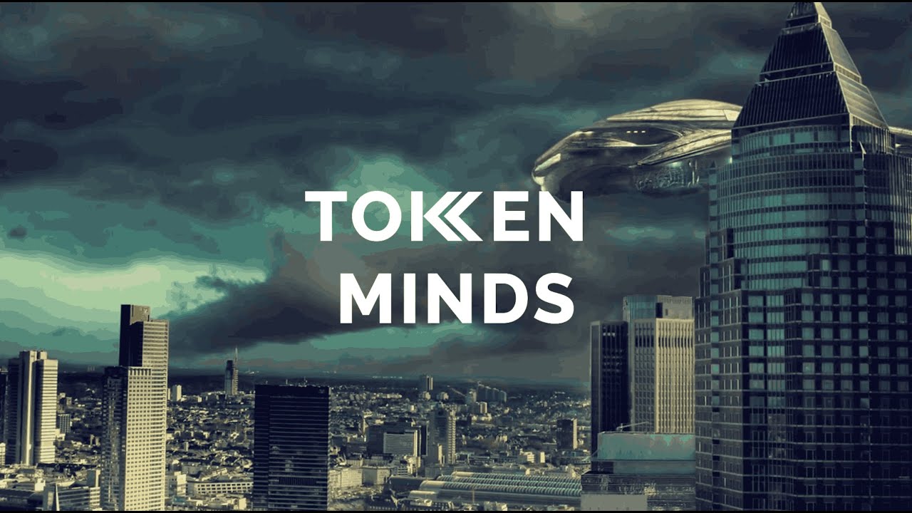 The TokenMinds logo over a city skyline under a stormy sky, a flying saucer beside a glass tower